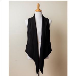 Vest with back buckle detail